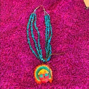 Turquoise beaded necklace with Indian headdress